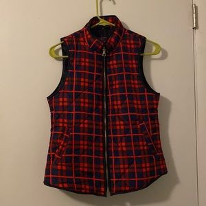 Navy and red vest. Worn few times. Great in fall and winter.
